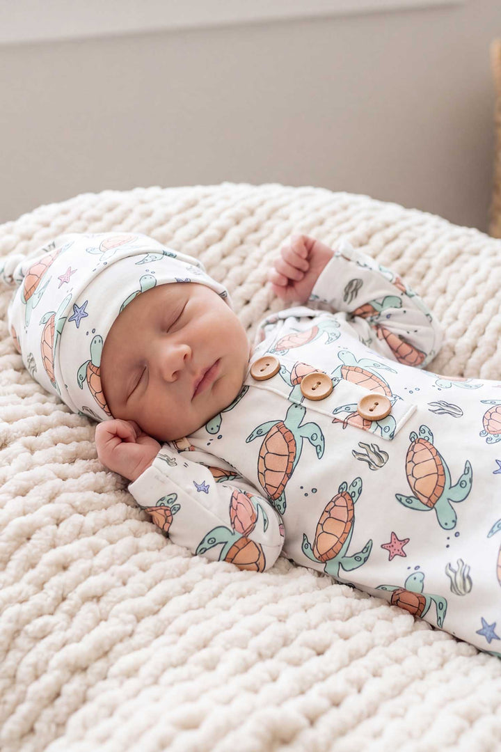 closeup of baby boy in turtle knot gown