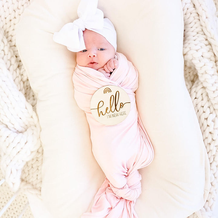 baby name wood announcement with rainbow 