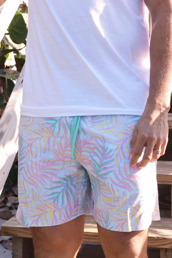 men's swim trunks with pastel palm leaves print - family matching swim trunks for dads - caden lane