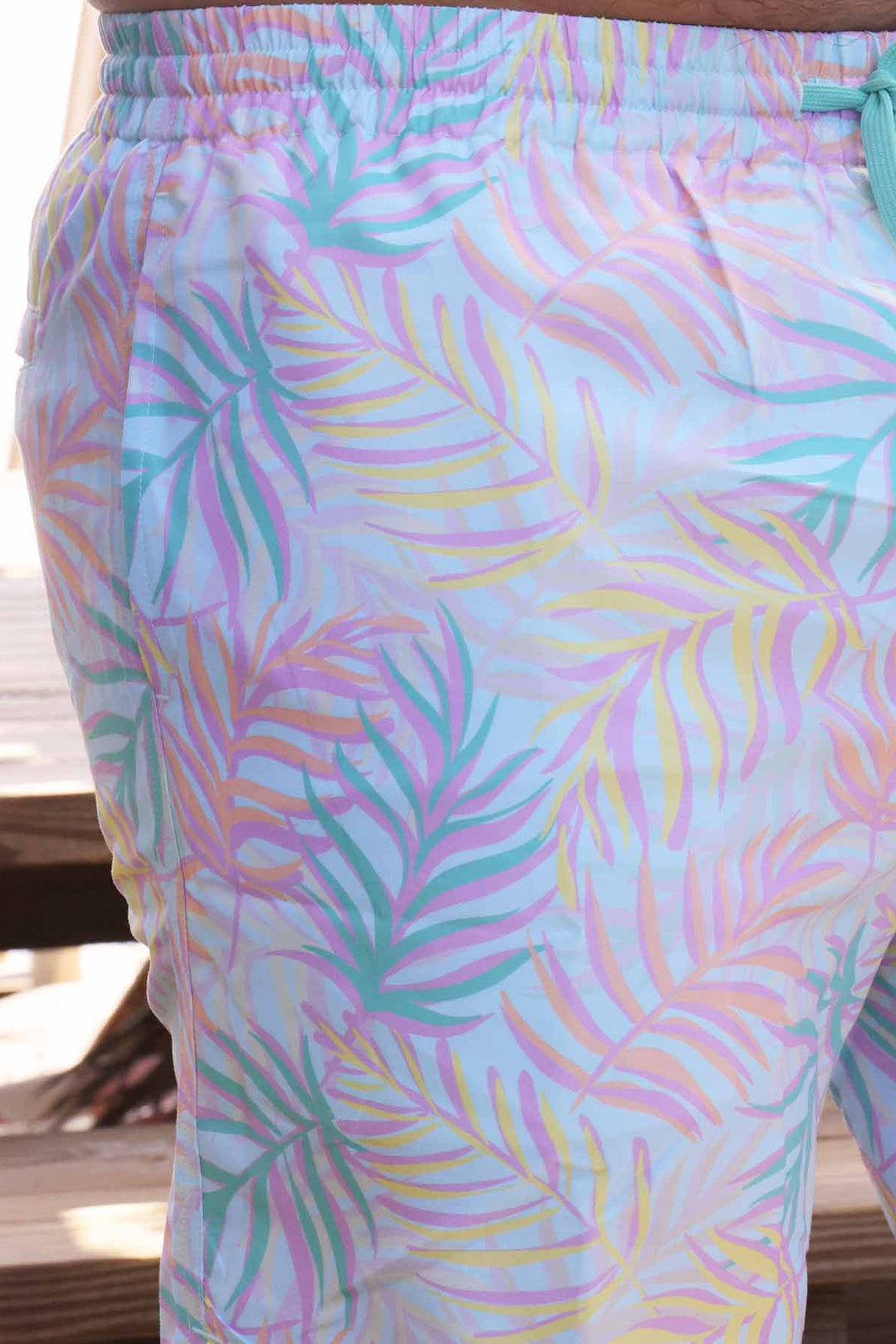 men's swim trunks with vibrant pastel palm leaves - family matching swim attire - caden lane
