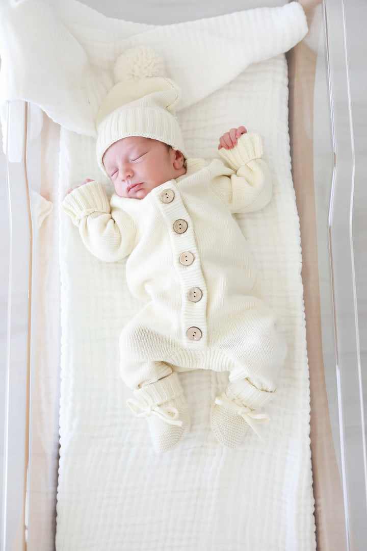 ivory long sleeve knit sweater romper with butons