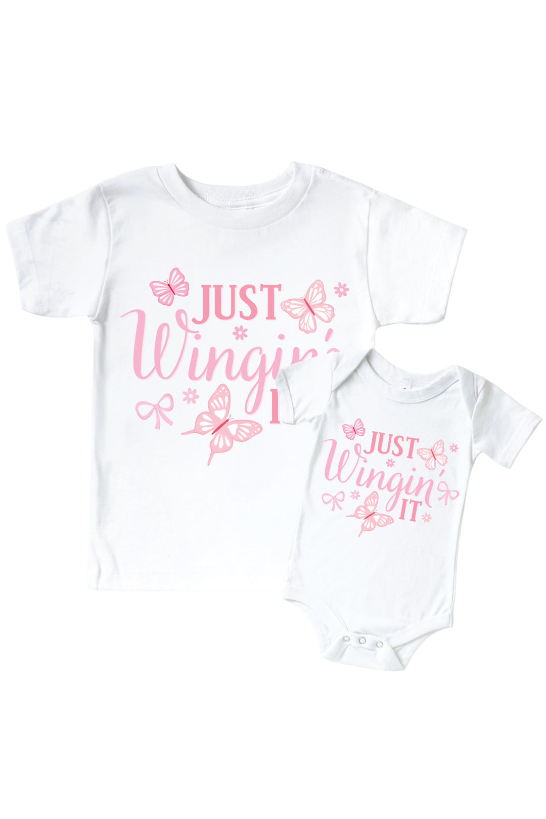 Just Wingin' It Graphic Bodysuit & Kids Tee in Blooming Butterflies print - white tee and baby bodysuit displayed together, both featuring pink "Just Wingin' It" text with butterfly and bow accents