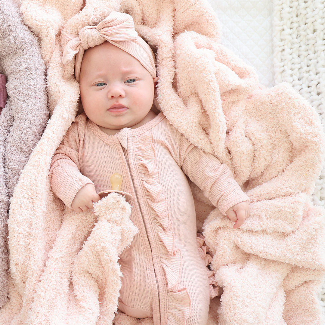 solid light pink cuddlelane plush blanket 