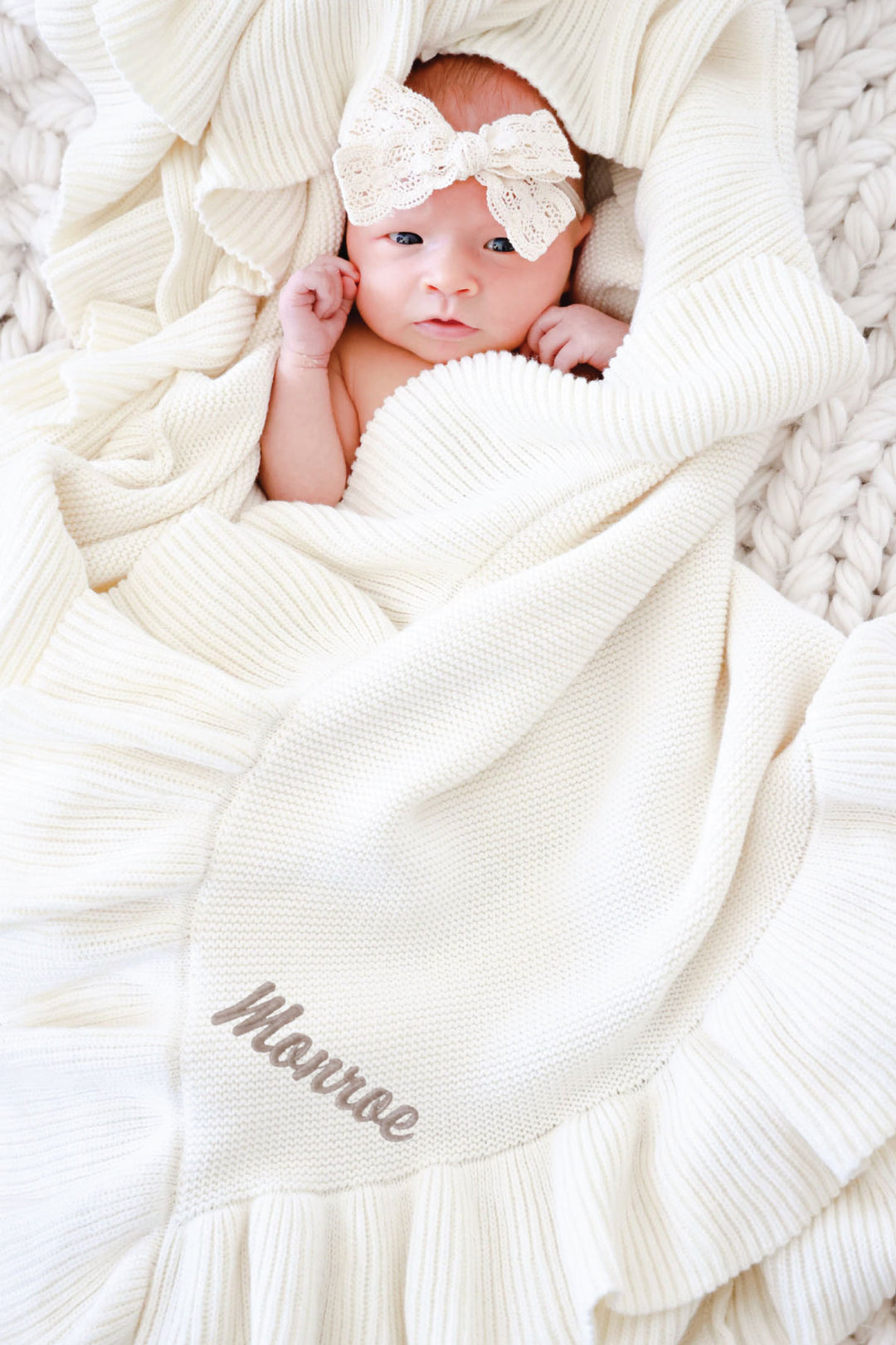 knit blanket in ivory with taupe colored thread for name embroidery