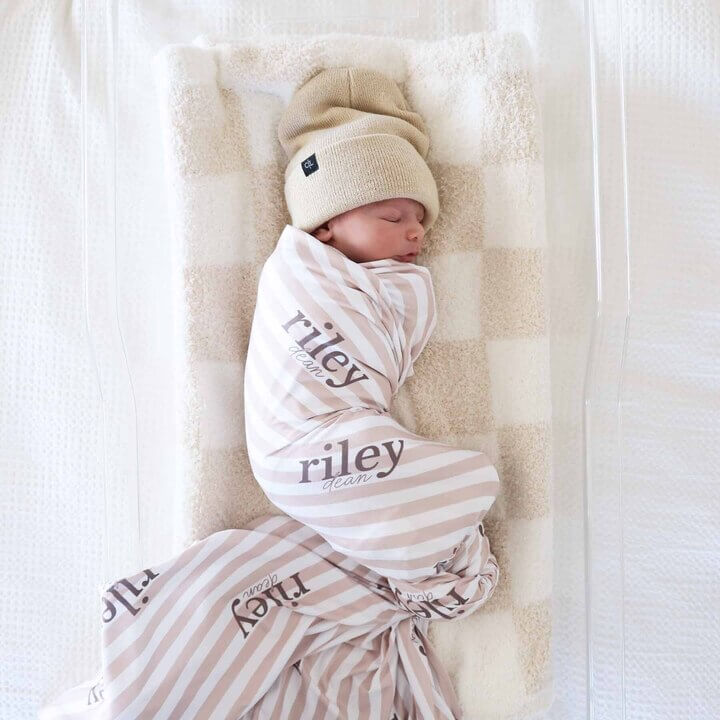 latte stripes personalized swaddle blanket for kids with brown writing 