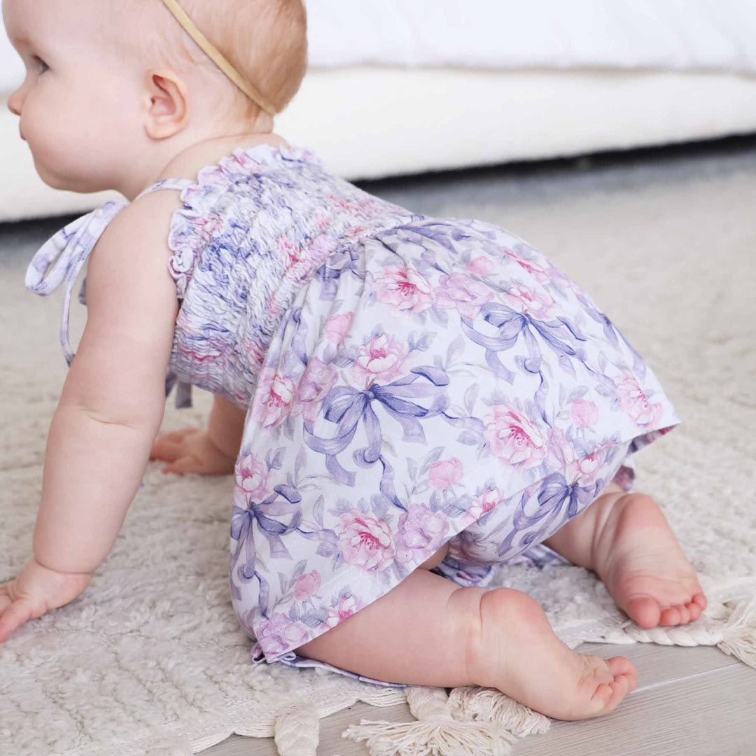 leighton's lavender smocked twirl bodysuit made of bamboo