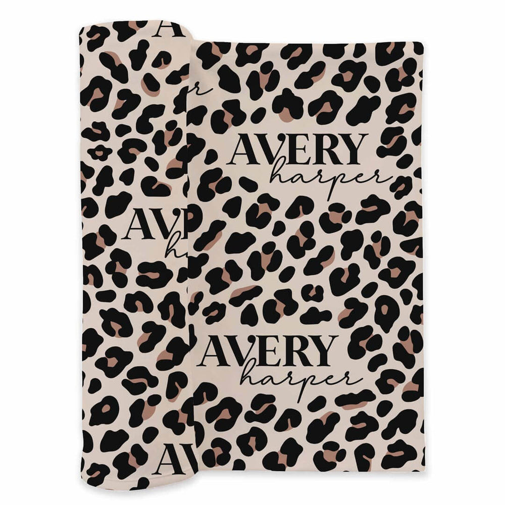 printed newborn baby swaddle with leopard animal print and personalized name 