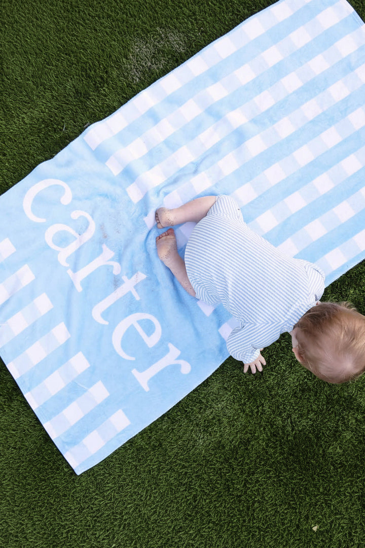 kids beach towel in blue seersucker with a velour printed side and plush white terry 
