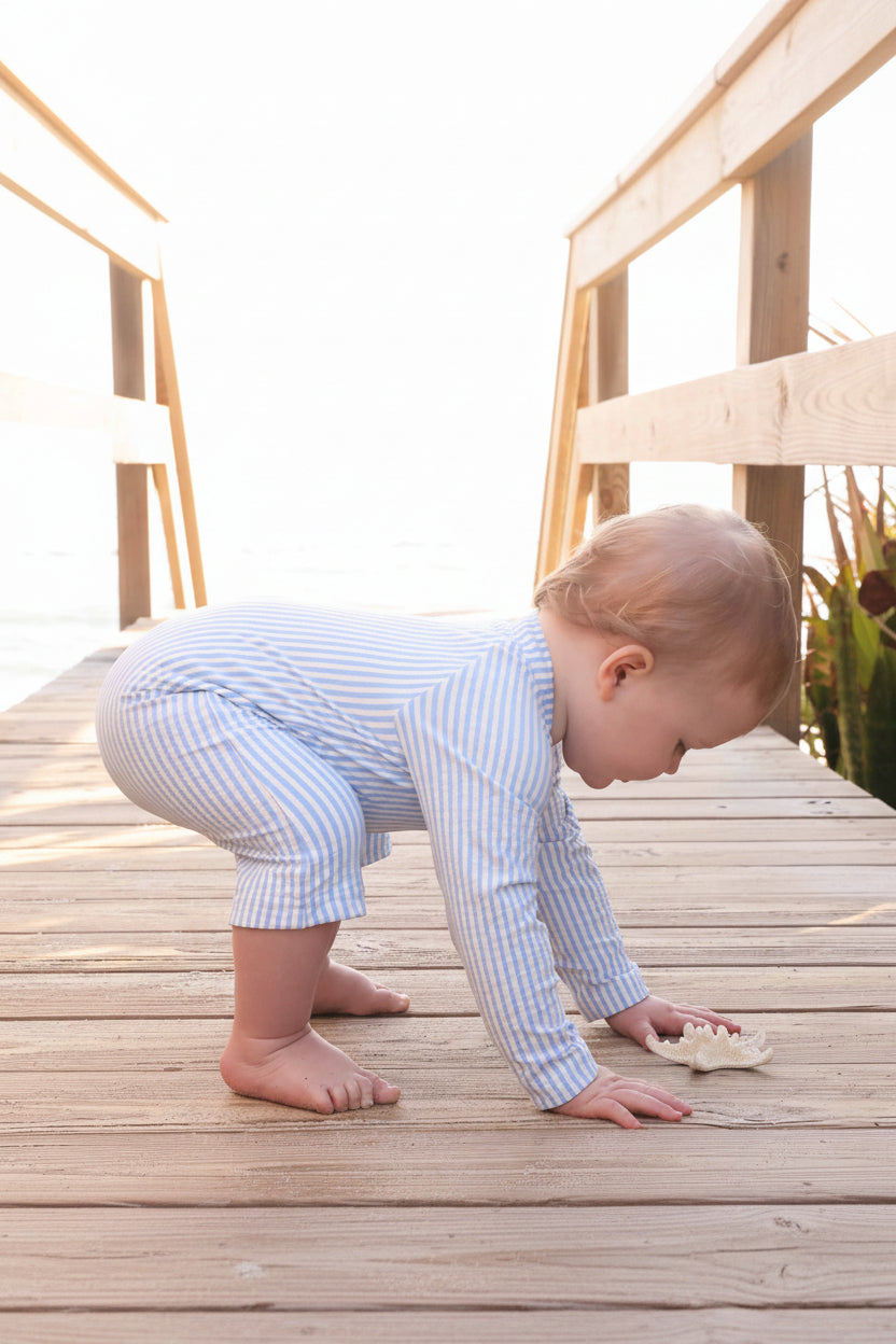 soft and comfortable seersucker blue swim shortie with built-in rash guard for babies