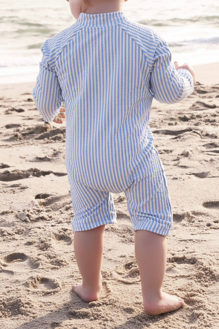 cute and comfy baby swim romper in blue seersucker with long sleeves