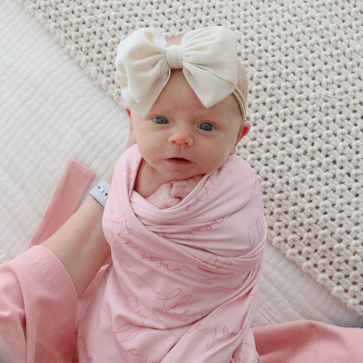 light on blush baby name swaddle blanket 