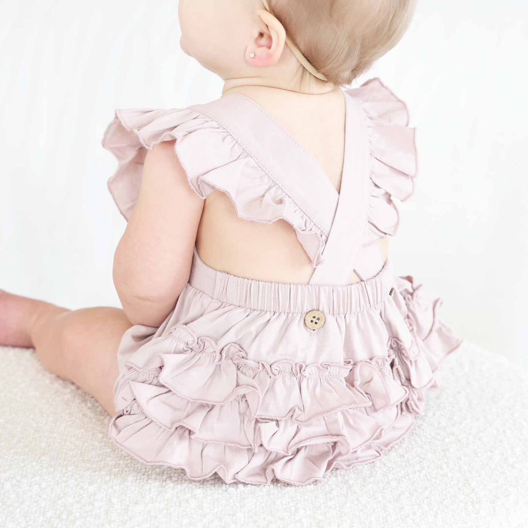 lilac cross back romper for baby and toddler girls 