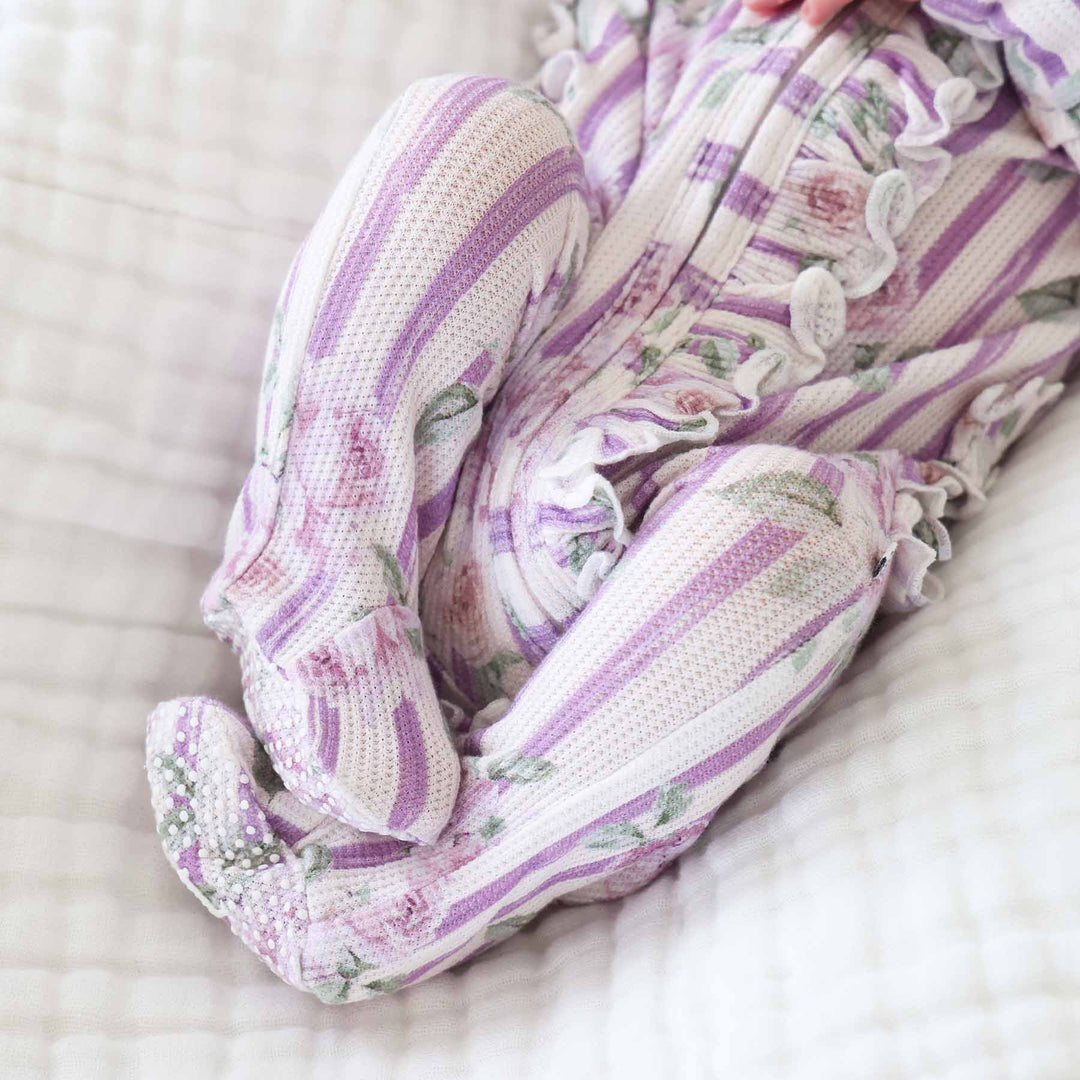 bamboo waffle ruffle zipper footie for baby girls in lila's lilacs print 