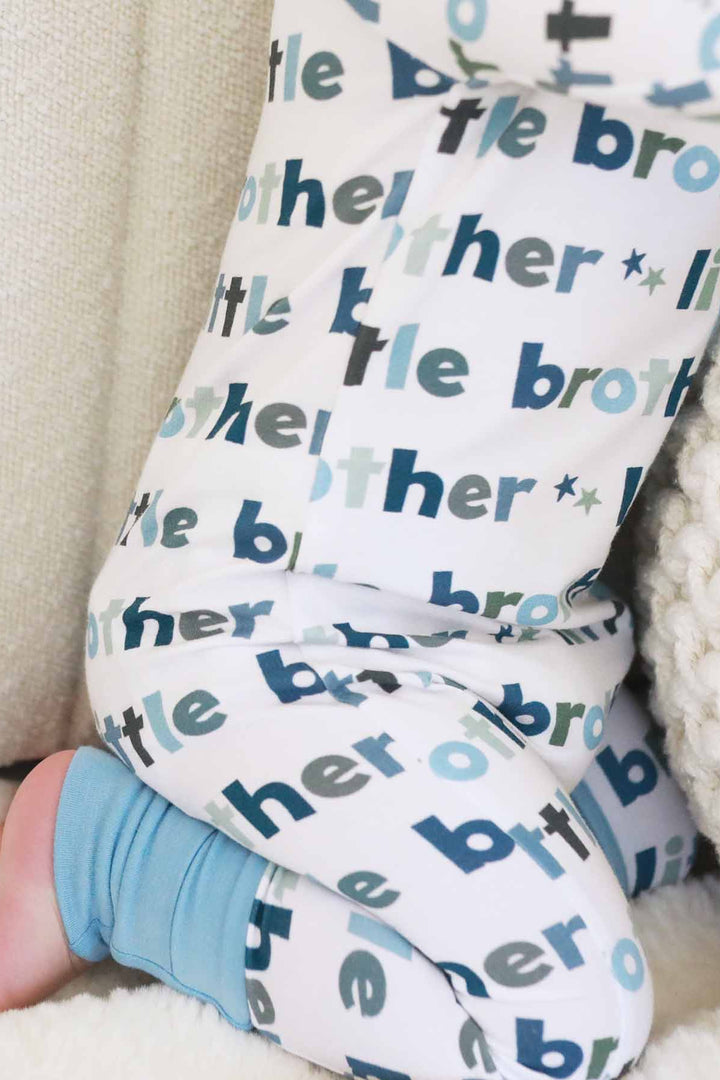 boy wearing little brother zip romper detailed
