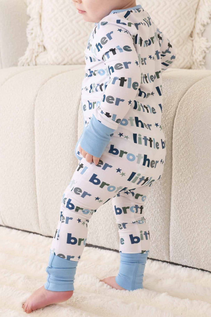 boy wearing little brother zip romper