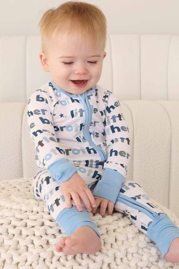 boy wearing little brother zip romper