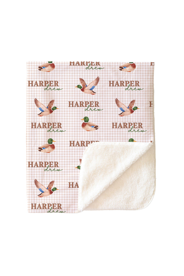 Personalized little mallard duck print blanket with corner folded back showing white sherpa fleece reverse side