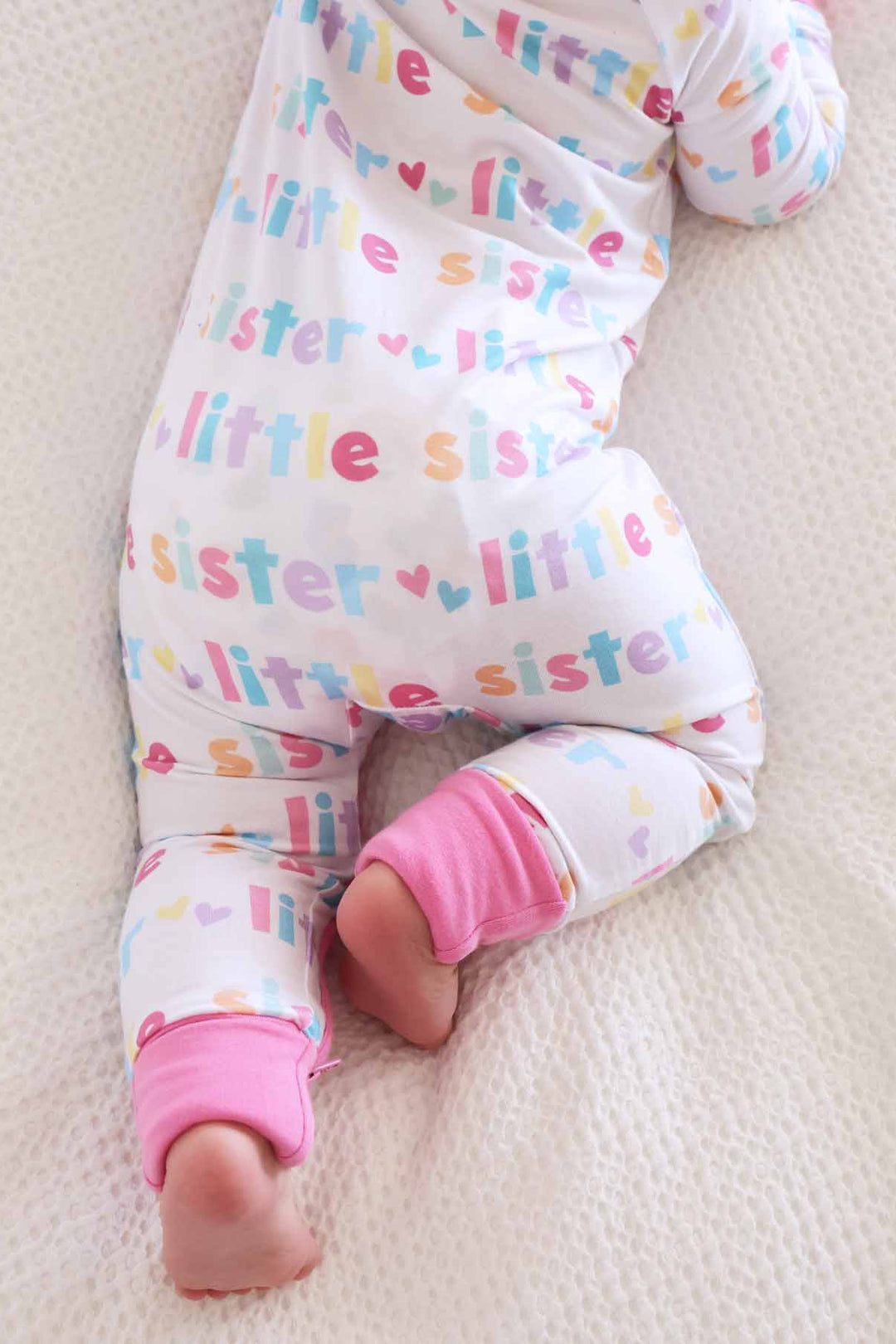 baby girl wearing little sister zip romper