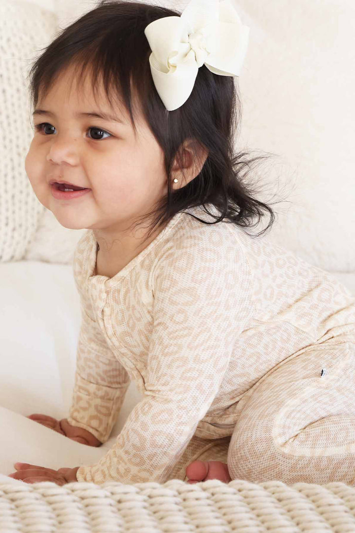 neutral leopard pajama romper for babies and toddlers