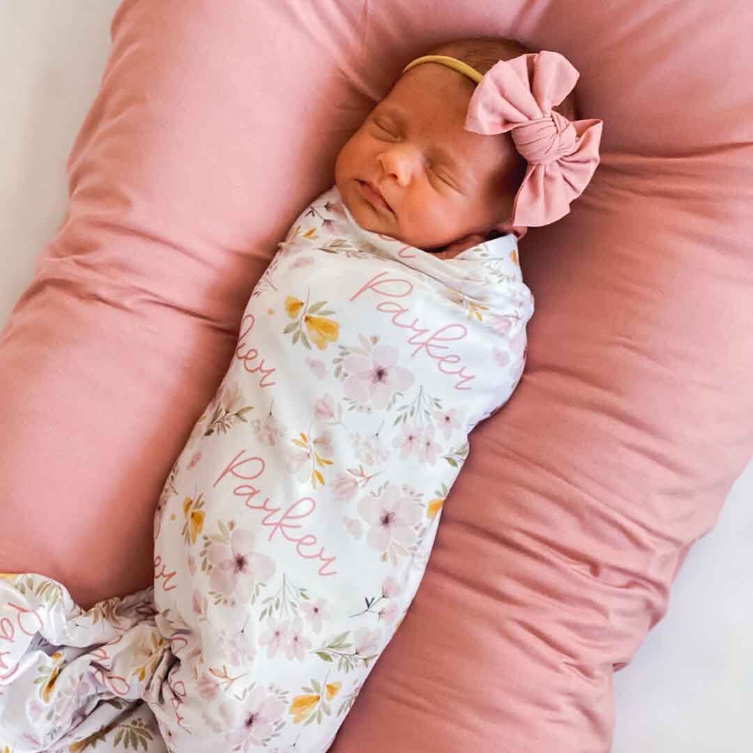 mauve and mustard floral personalized swaddle 