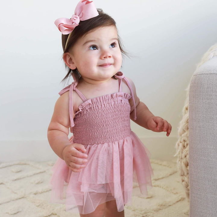 smocked tutu bodysuit mauve