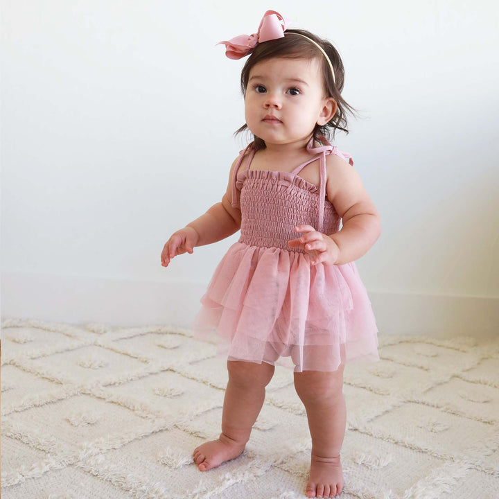 smocked bodysuit for babies with tutu light pink 