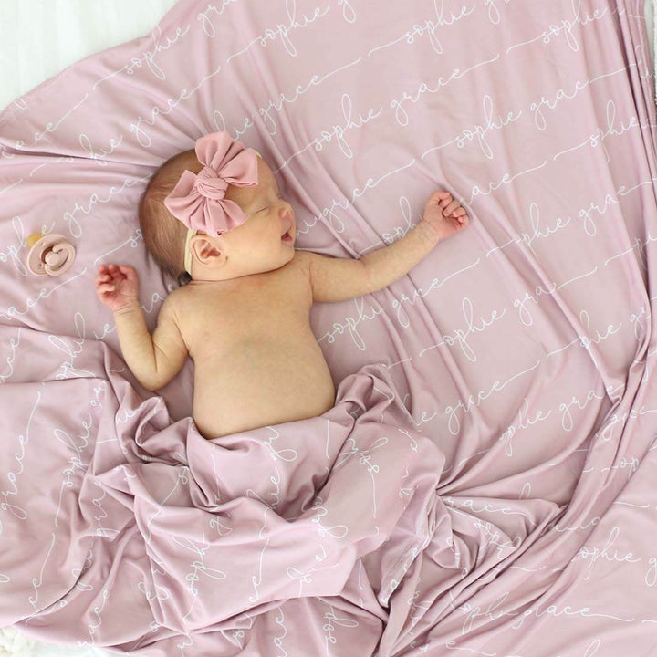 personalized mauve baby name swaddle blanket all script 