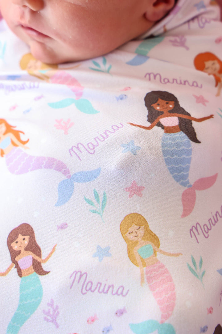 close-up of mermaid print on personalized swaddle blanket