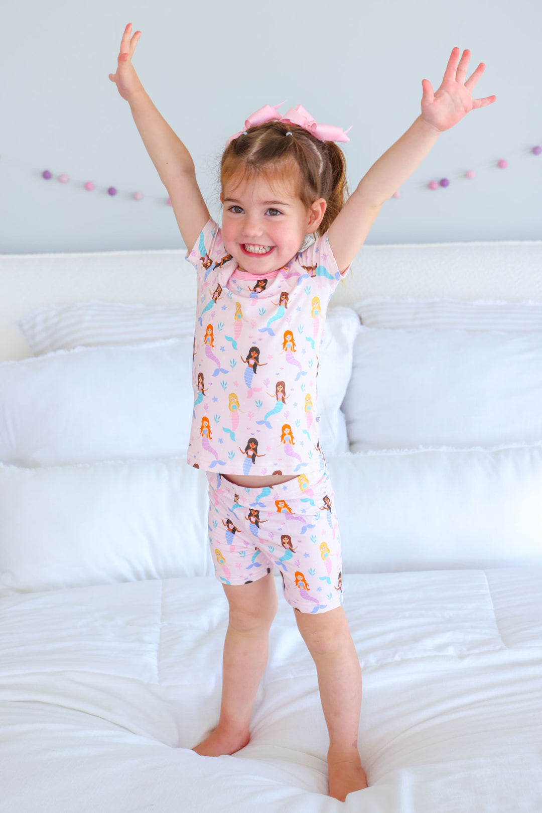 baby wearing let's be mermaids bamboo short pajama set, lifestyle photo