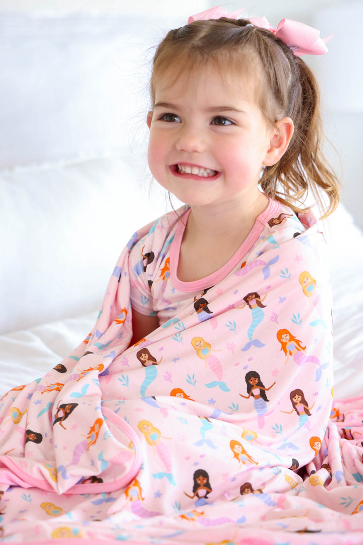 baby with let's be mermaids double sided bamboo blanket, lifestyle