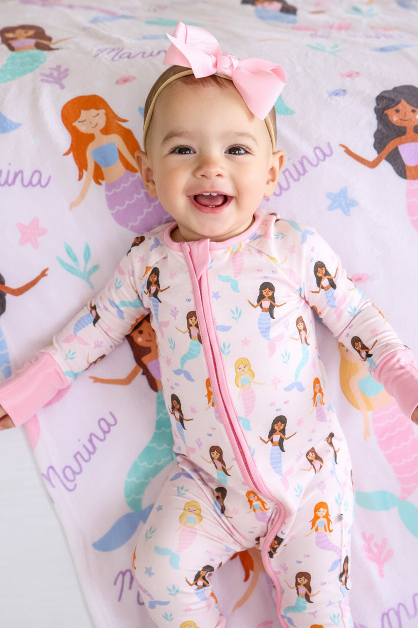 child with personalized let's be mermaids blanket, lifestyle photo