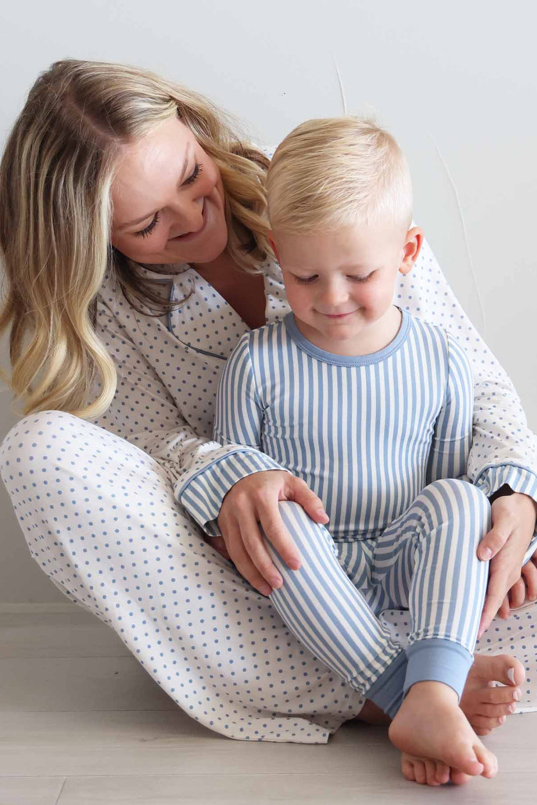 mom and son matching lounge and pajama sets with blue and white stripes and polka dots 