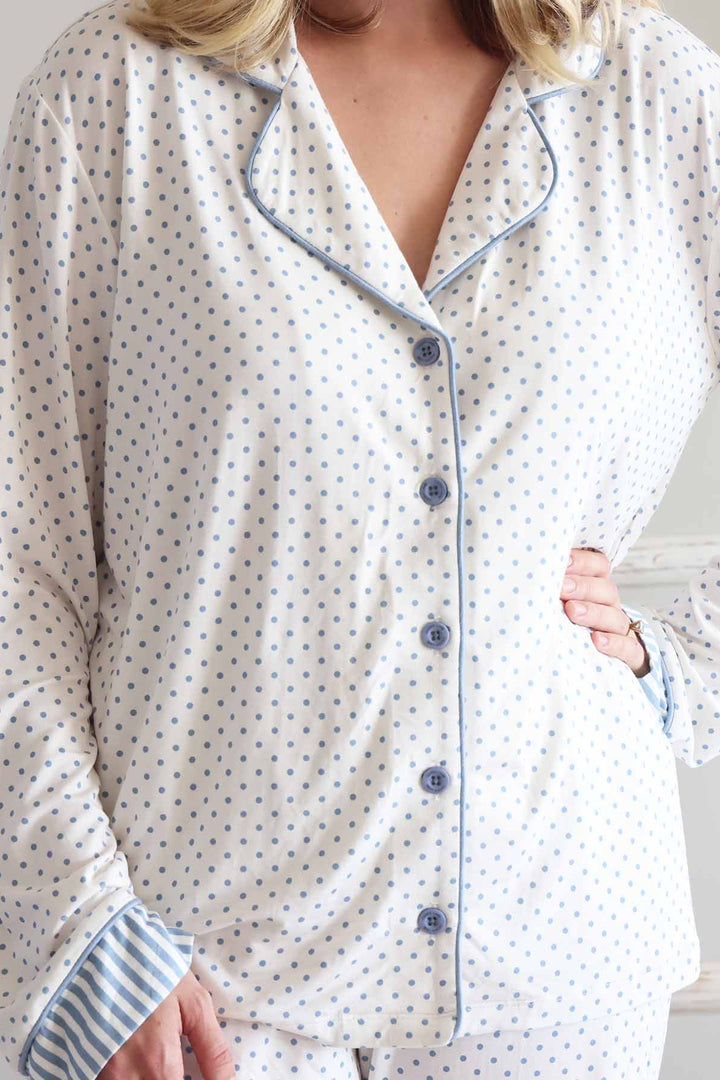 women's long sleeve flare lounge set with with blue polka dots with stripe detailing at the bottom of the sleeves 