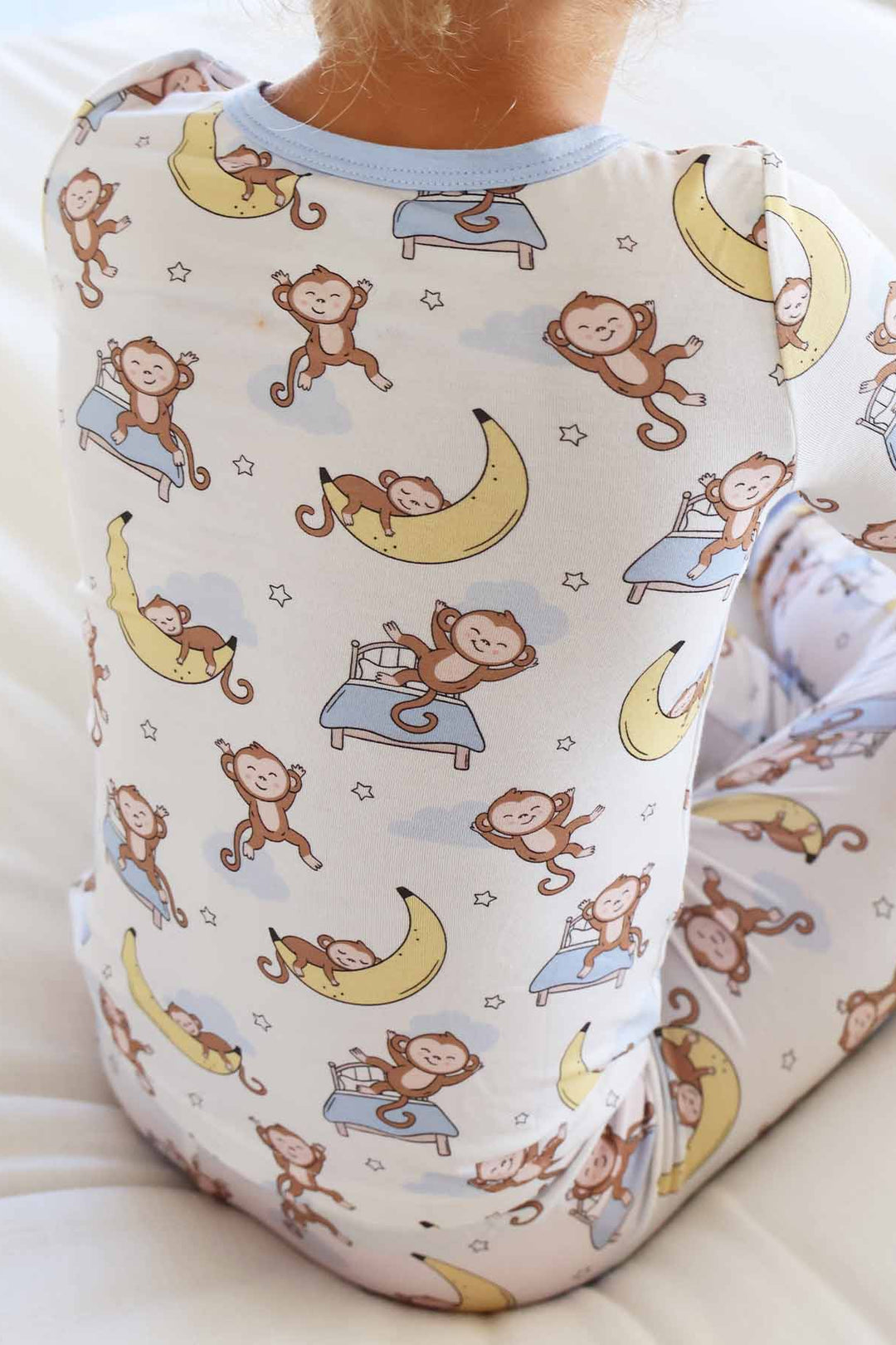 gender neutral sleeping monkey and banana two piece pajama set for kids 