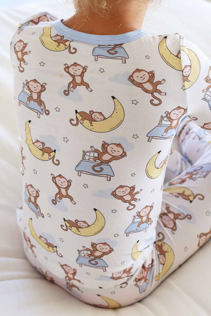gender neutral sleeping monkey and banana two piece pajama set for kids 
