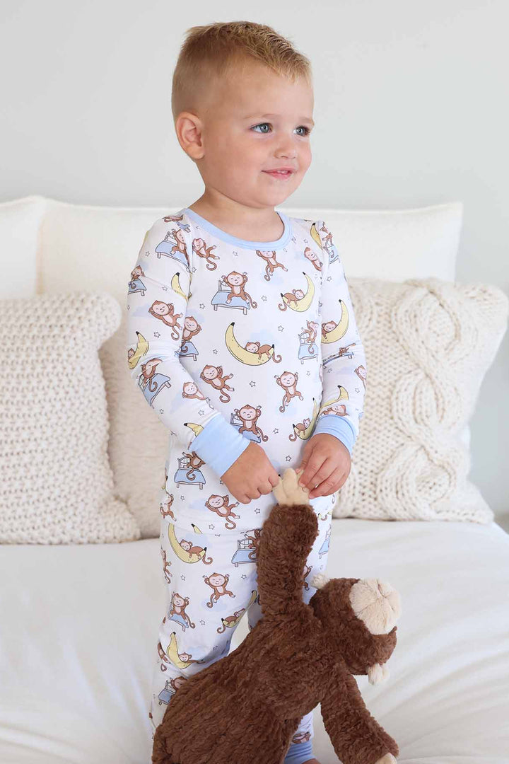 white two piece pajama set for kids with monkeys and bananas 