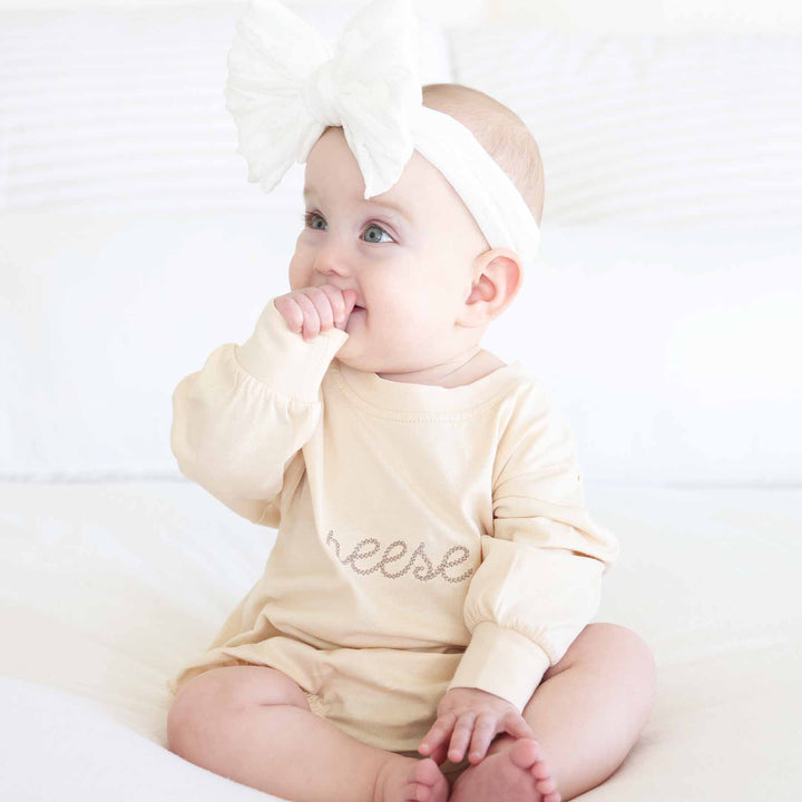 name embroidered romper with neutral thread 