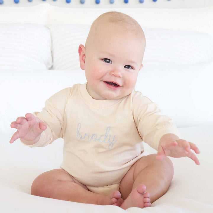 light blue long sleeve embroidered bubble romper for babies 