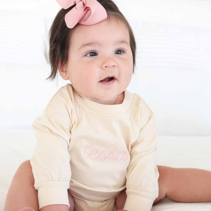 light pink name embroidered romper 