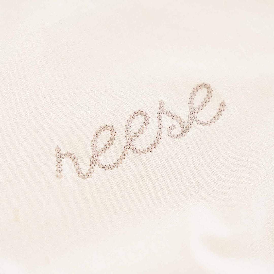 neutral embroidered long sleeve bubble romper tee