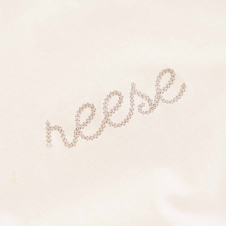 neutral embroidered long sleeve bubble romper tee