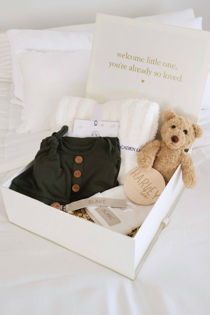 baby shower gift box bundle with neutral earthy tone knotgown, blanket, bear stuffed toy, beanie