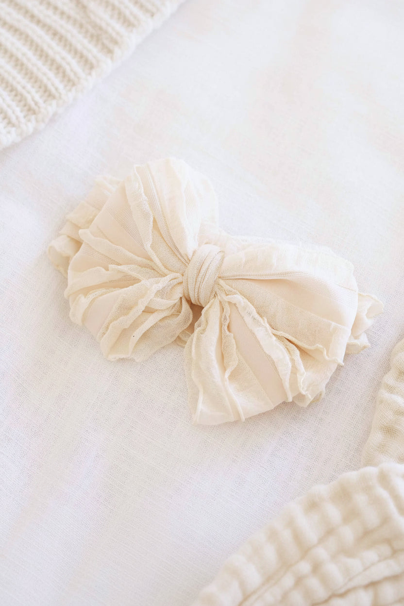 nude large ruffle knit bow