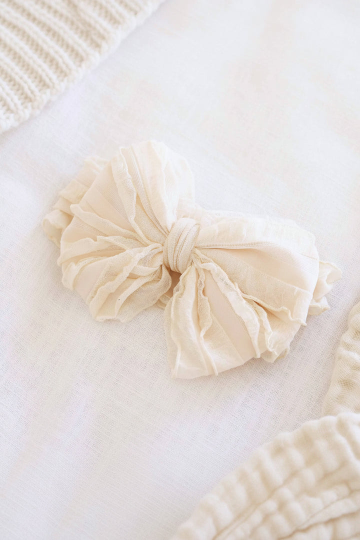nude large ruffle knit bow