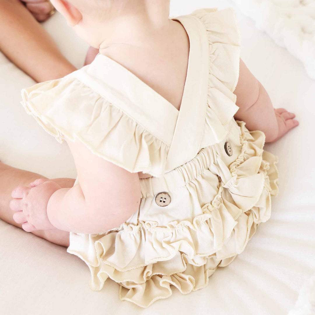 oat cross back ruffle bottom romper for bbaies and toddler girls 