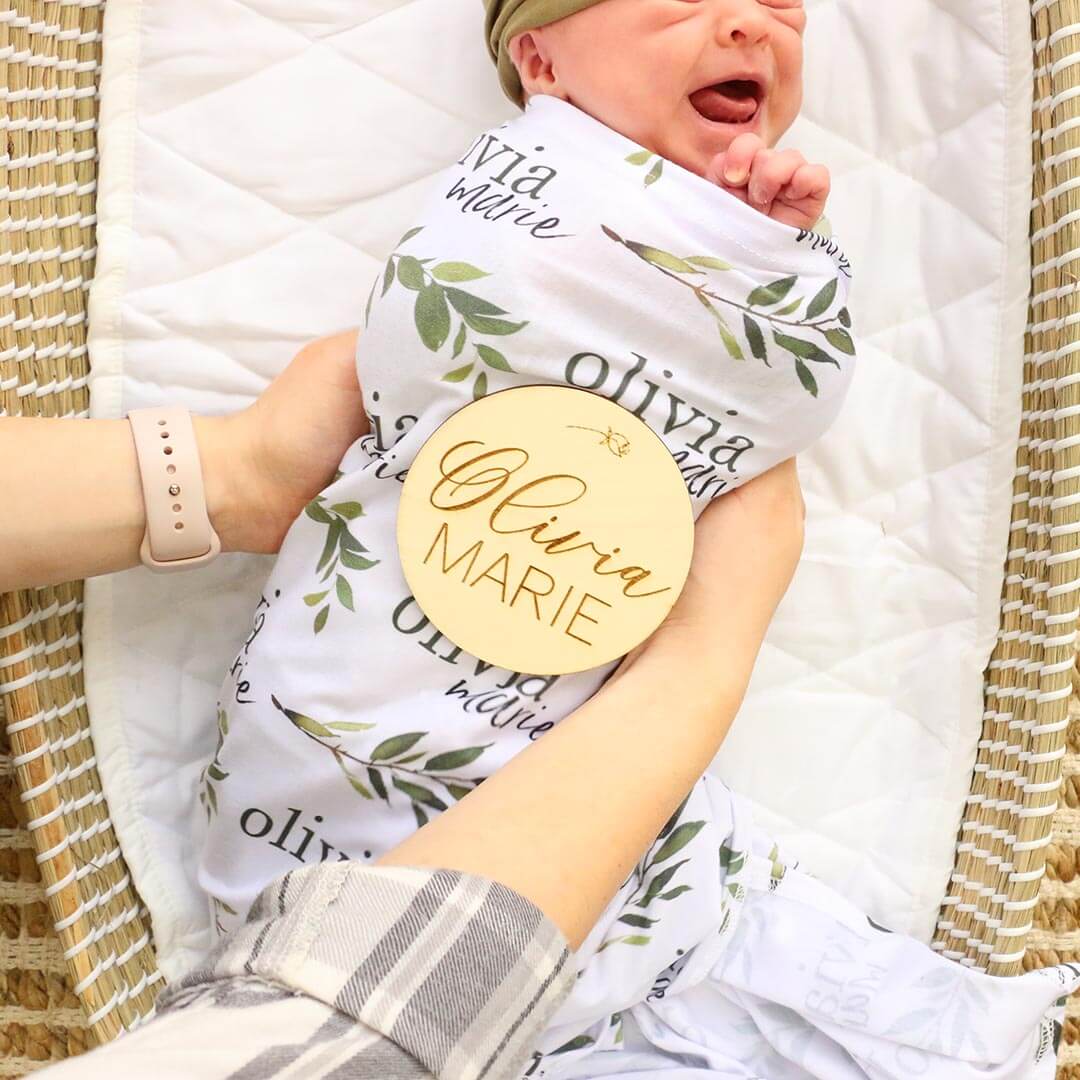 baby name wood announcement with flower 