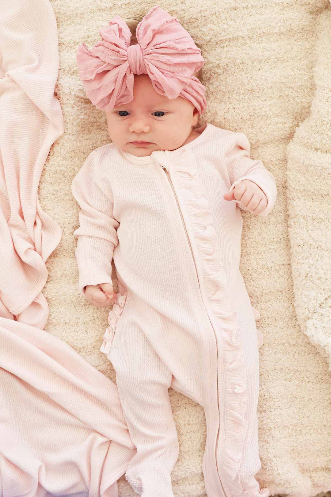 light pink bamboo waffle zipper footie with ruffles 