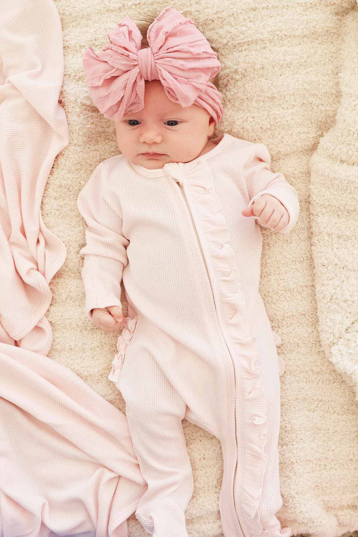 light pink bamboo waffle zipper footie with ruffles 