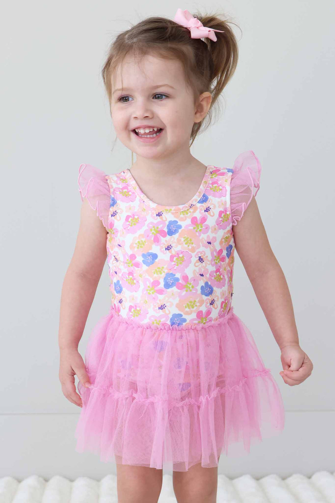 girl looking to the side in spring floral tulle skirt leotard