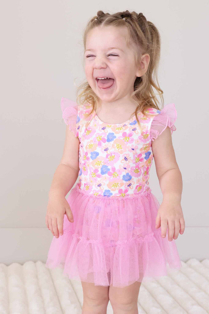 laughing girl in spring floral tulle leotard skirt 